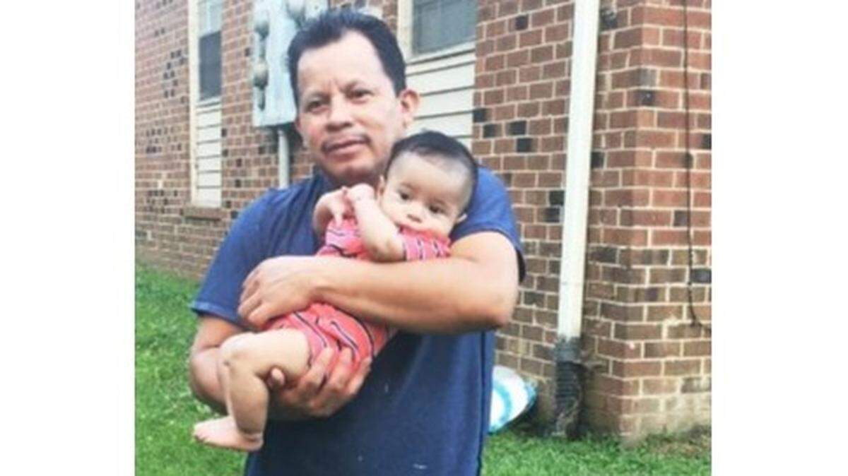 Salvador Omar Sanchez holds a child, before he was killed in a fatal hit-and-run in Durham.