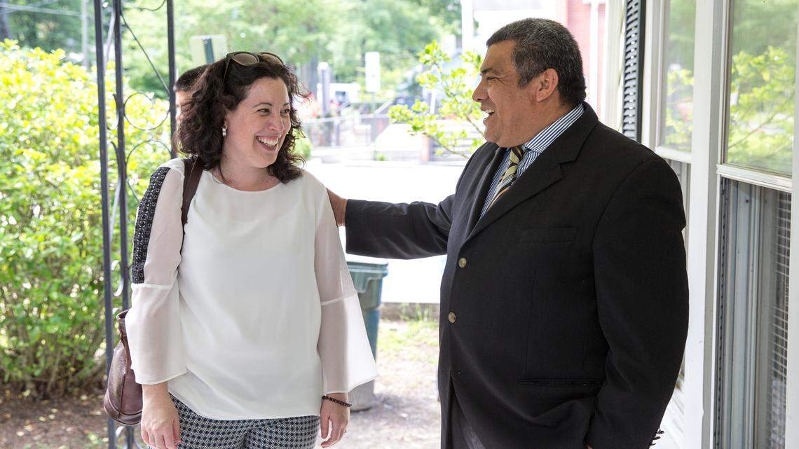 Durham City Council member Javiera Caballero, left, visits Jose Chicas, who has taken sanctuary from deportation at St. John's Baptist Church School for Conversion in Durham.