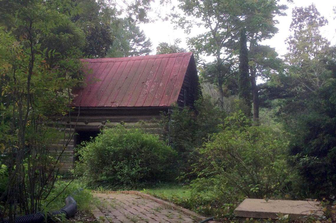 An old shed behind the Keith homestead is one of the few buildings standing at the Keith Arboretum. An Orange County conservation easement limits where new buildings can be constructed and the purposes they can serve.