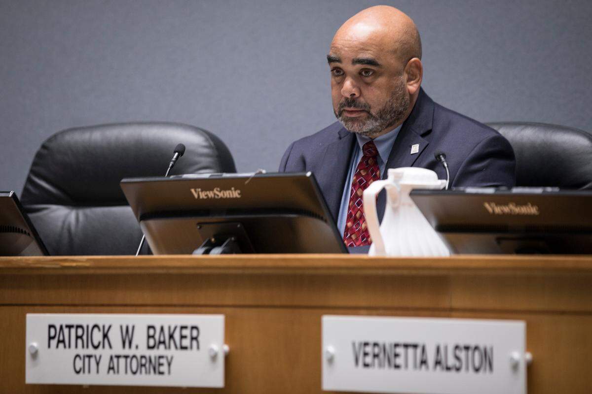 Durham City Attorney, Patrick Baker, awaits the start of a City Council meeting at City Hall on Monday, August 6, 2018.