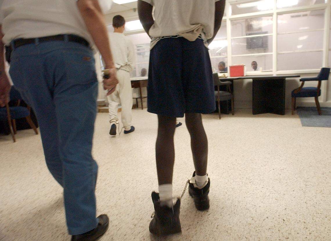 In this 2015 file photo, juveniles arrive in shackles and handcuffs at the Dillon Regional Juvenile Detention Center, which is currently being used to house minors waiting for thier case to work its way through the juvenile justice system.