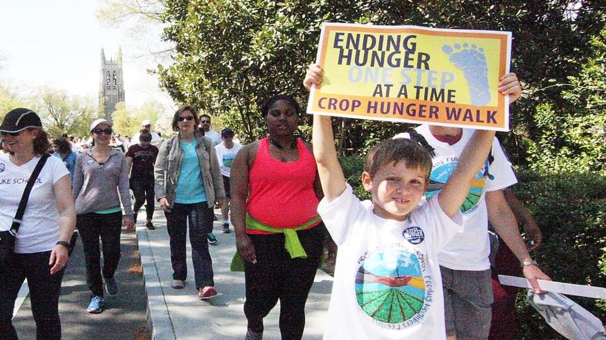 Nicholas Thomas of Durham said an empathy for those who don’t have enough to eat prompted him to bring his mother, Stephanie, to the Durham Crop Walk on Sunday.