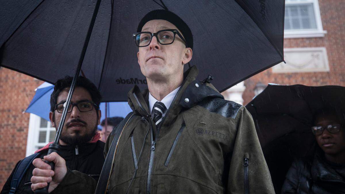 Dwayne Dixon pauses while speaking to press outside of the Orange County Courthouse before his trial on Thursday, Nov. 15, 2018.