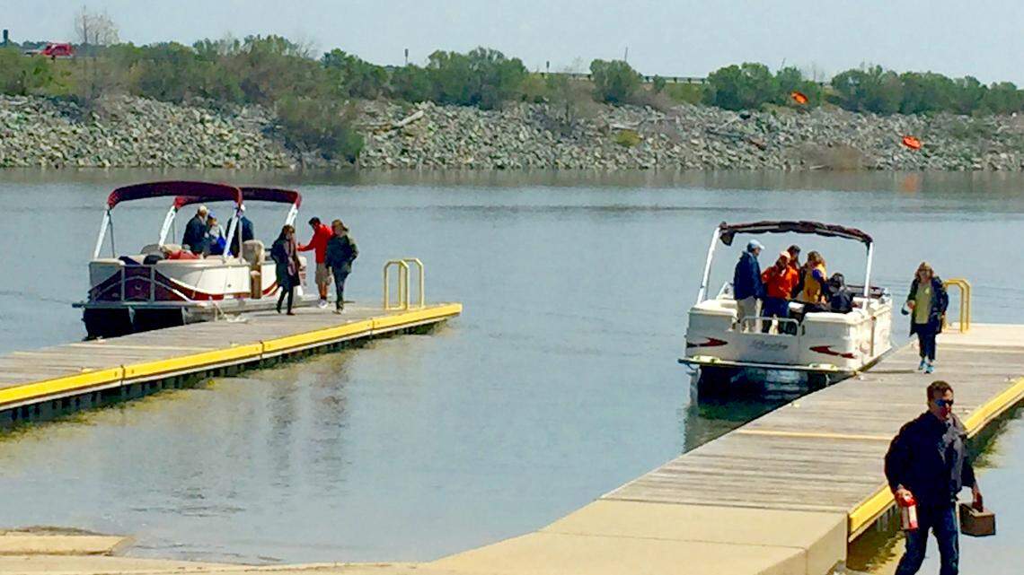 Two boats carried locally-elected officials on a tour of Jordan Lake on Wednesday to see the effects of urbanization on the body of water which is a regional drinking water source.