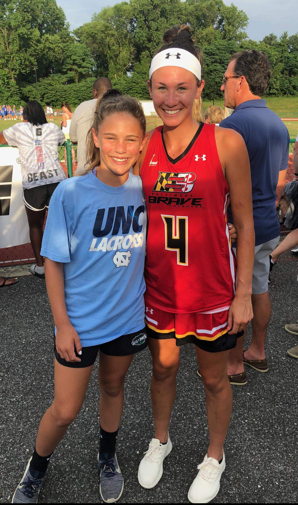 A young Kate Levy poses with Marie McCool, a former decorated Tar Heel player and current assistant coach for UNC women’s lacrosse.
