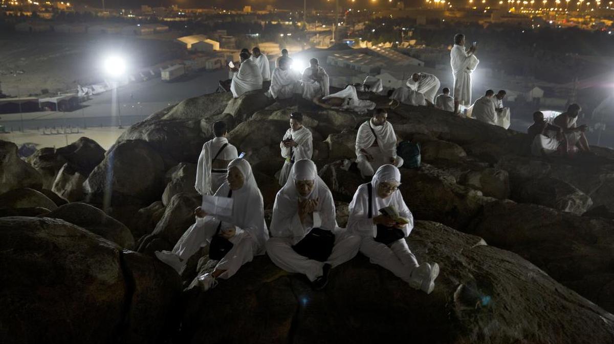 Muslim pilgrims pray on top of the Jabal Al Rahma holy mountain, or the mountain of forgiveness, upon their arrival to Arafat for the annual hajj pilgrimage outside the holy city of Mecca, Saudi Arabia on Aug. 30.