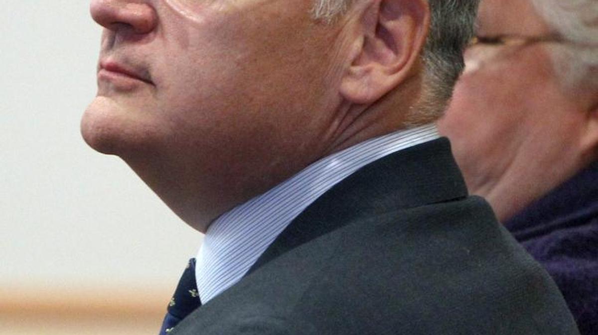 In this April 23, 2014 file photo, Monsignor Edward Arsenault looks back before pleading guilty to three felony theft charges in Hillsborough County Superior court in Manchester, N.H.