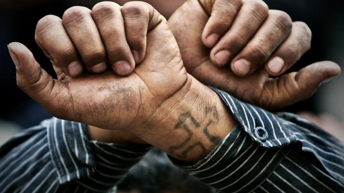 In this Friday, April 14, 2006 file photo, Egyptian Copts cross their wrists in defiance outside the Saints Church in the Sidi Bishr district of Alexandria in Egypt. Egypt’s Coptic Christians have become the preferred target of Islamic State radicals operating in the Arab world’s most populous nation, seeking to sow discord, undermine President Abdel-Fattah el-Sissi, and split the country.
