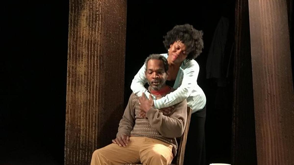 Chloe (Lakeisha Coffey) comforts her father Percy (Trevor Johnson) in this scene from Manbites Dog Theater and StreetSigns’ production of “The Miraculous and the Mundane,” a play by Howard L. Craft. The production continues through April 1 at Manbites Dog Theater, 703 Foster St., Durham. For tickets, visit www.manbitesdogtheater.org.