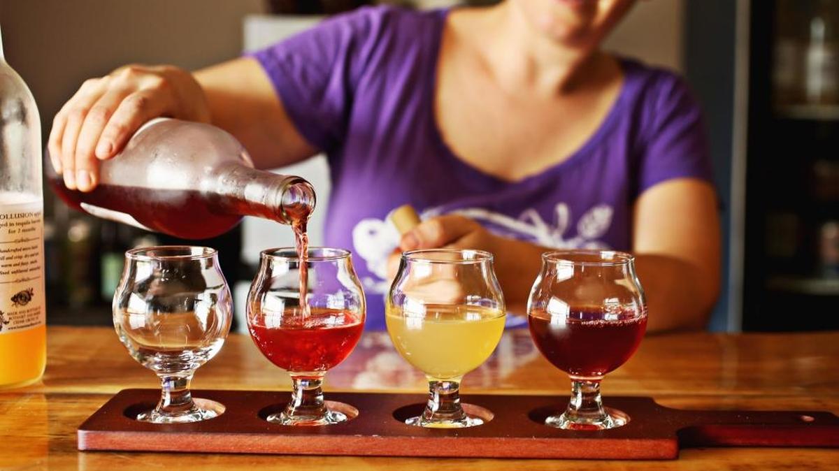 Kether Smith, who operates Botanist and Barrel, pours a flight in the new on-site tasting room in Cedar Grove. Its small-batch wines and ciders have become available in shops from the Triangle to Asheville.