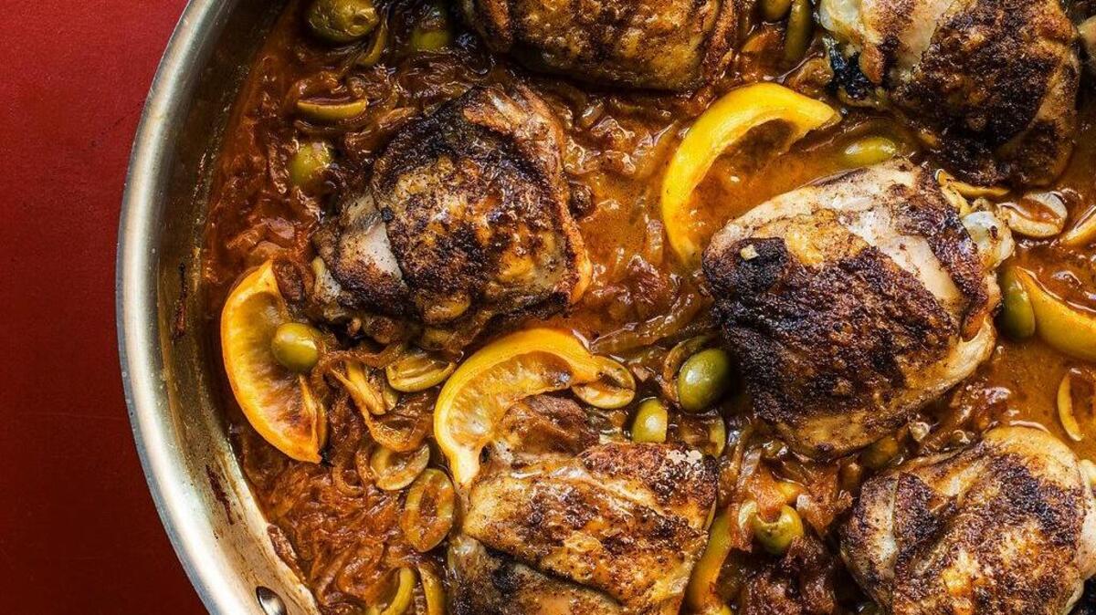 This February 2017 photo shows braised chicken with green olives and onions in New York. This dish is from a recipe by Katie Workman.