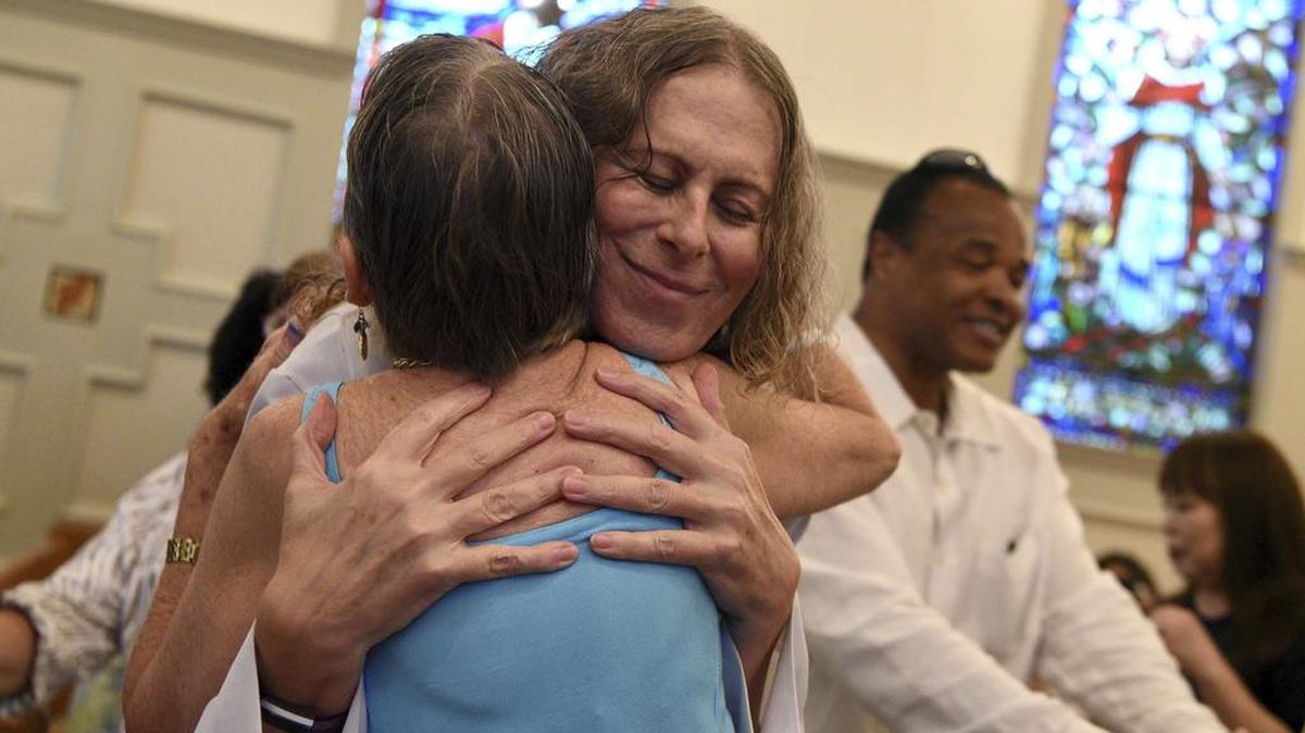 Petra Strand and a congregant of St. Mark’s Episcopal Church in Teaneck offer each other “The Peace,” during services at on Sunday, July 16, 2017. Strand served as a guest preacher during the Sunday service. Strand is on a quest to find a new role in her religious life after transitioning her gender identity. Strand formerly known as Peter Strand, was a pastor at First Presbyterian Church in Ridgefield Park for 15 years. Strand left the church and is now a member at St. Mark’s.