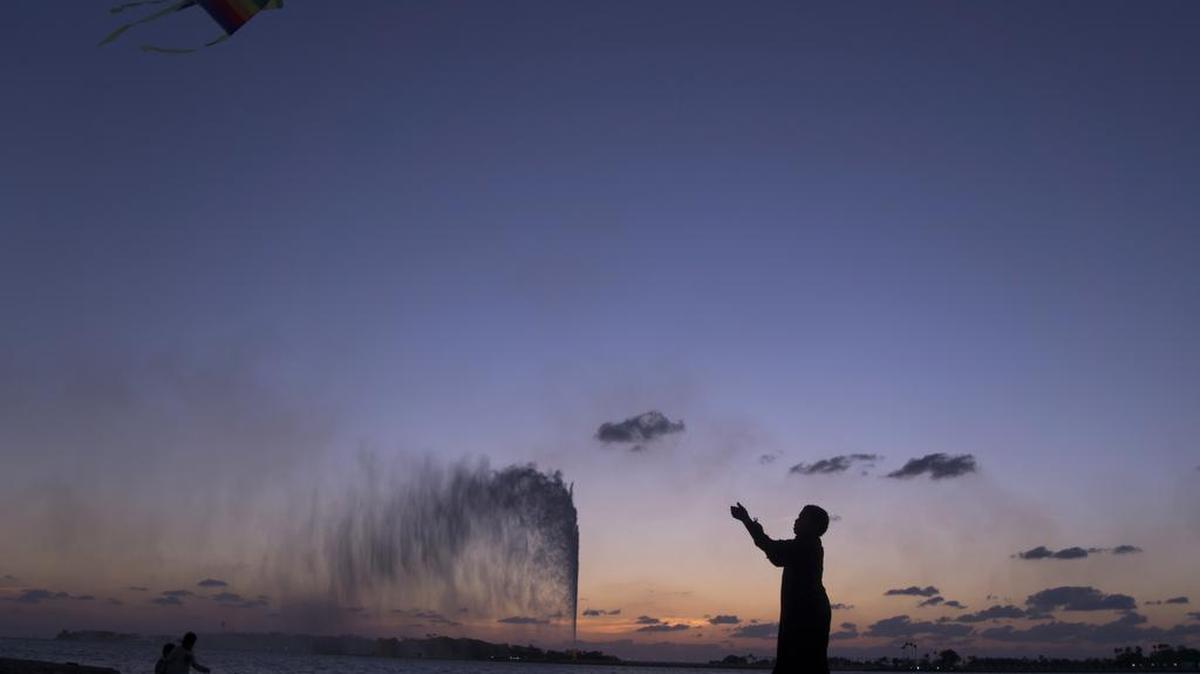 In this Monday, Feb. 20, 2017 file photo, a boy flies a kite on the Red Sea beach near the landmark Jiddah fountain, in Jiddah, Saudi Arabia. Saudi Arabia is planning to build a semi-autonomous luxury travel destination along its Red Sea coast that visitors can reach without a visa. The Red Sea area, which will include diving attractions and a nature reserve, will be developed with seed capital from the country’s Public Investment Fund.