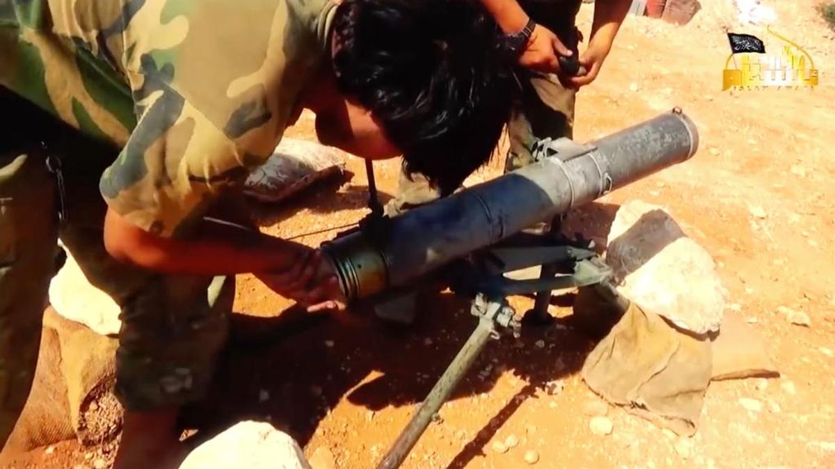 This frame grab from video provided in August 6, 2016, by Turkistan Islamic Party, a militant website outlet that is consistent with independent AP reporting, shows a fighter from the Turkistan Islamic Party prepares to fire a missile during a battle against Syrian government forces, in Aleppo, Syria. Many don’t speak Arabic and their role in Syria is little known to the outside world. Chinese fighters of the Turkistan Islamic Party in Syria are organized, battled-hardened and have played instrumental roles in ground offensives against President Bashar Assad’s forces in the country’s northern regions.