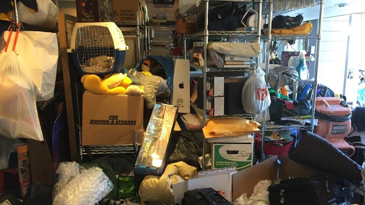This photo provided by Regina Lark shows a garage organization project in Los Angeles, Calif. The image shows a garage before being organized to the client’s goals.