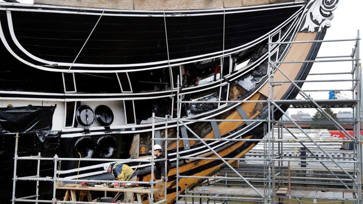 Restoration work continues on the USS Constitution in dry dock, Wednesday, April 5, 2017, at the Charlestown Navy Yard in Boston. The ship enters dry dock for below-the-waterline repairs every 20 years. The world's oldest commissioned warship afloat is scheduled to return to the waters in late July.