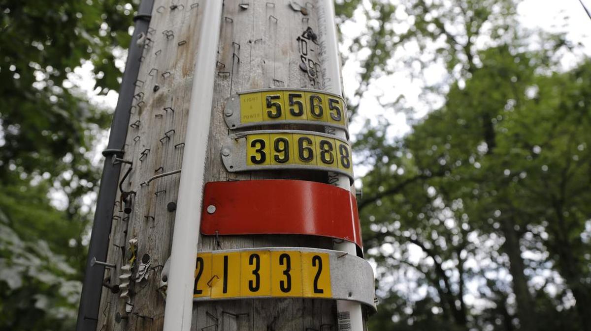 In this Saturday, Aug. 5, 2017, photo, polyvinyl chloride piping is seen on an utility pole on Airmount Road in Mahwah, N.J. Thin strips of PVC piping placed on utility poles around a New Jersey town bordering New York have stirred worries that an ultra-Orthodox Jewish community plans to expand. Along with a measure to limit Mahwah’s parks to town residents, it has led to backlash from those who say the opposition raises worries about anti-Semitism. The county’s prosecutor ordered the police not to enforce that measure after Mahwah’s police chief raised concerns that complaints were targeting Jews.