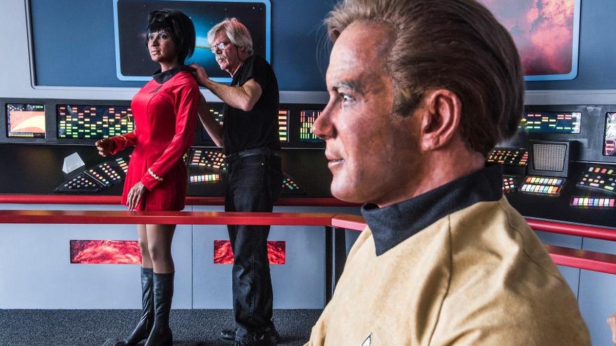 Steve Greenthal adjusts the wax head of Star Trek character Uhura on its body next to a figure of Captain Kirk at the Fullerton Airport in Fullerton, Calif.