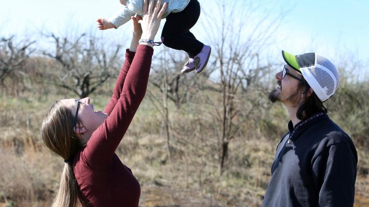 Bekah Quirin and her husband Derrick pose for a photo with their daughter Ellie, 1, in Daleville, Va. None of the Blue Ridge couple's adventures have been quite like the one they’re undertaking, tackling the 2,190-mile length of the Appalachian Trail while carrying Ellie.