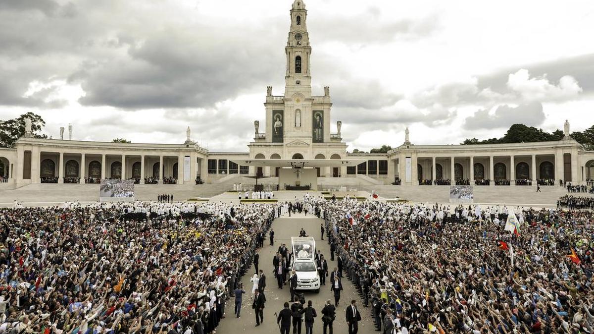 Pope Francis in his popemobile leaves at the end of a Mass where he canonized shepherd children Jacinta and Francisco Marto at the Sanctuary of Our Lady of Fatima, Saturday May 13, 2017, in Fatima, Portugal. Pope Francis urged Catholics on Friday to “tear down all walls” and spread peace as he traveled to this Portuguese shrine town to canonize two poor, illiterate shepherd children whose visions of the Virgin Mary 100 years ago marked one of the most important events of the 20th-century Catholic Church.