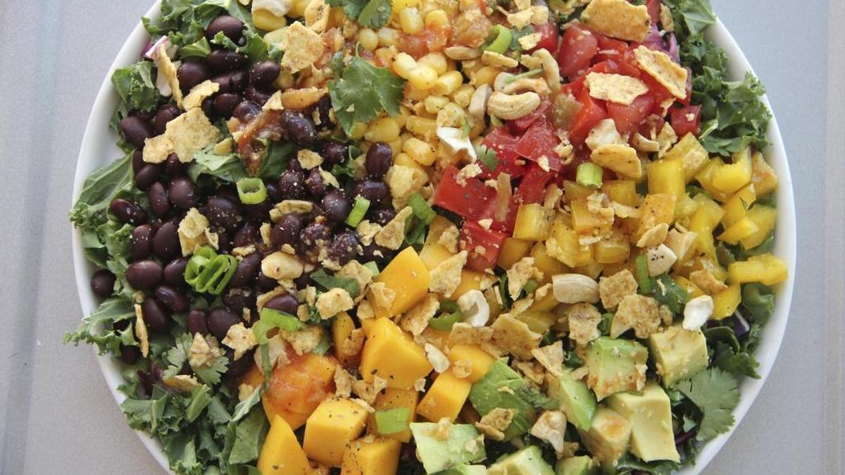 This March 9, 2017 photo shows a black bean and mango salad in Coronado, Calif. This dish is from a recipe by Melissa d'Arabian.