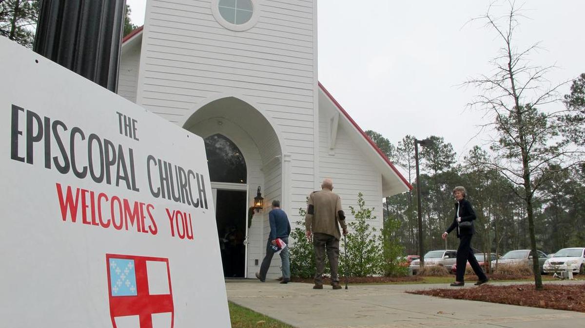 In a Dec. 16, 2012 file photo, members of the Conway Worship Group gather at the chapel at Coastal Carolina University in Conway, S.C. The members of the fledgling congregation left their home church after it decided to follow the Diocese of South Carolina and leave the national Episcopal Church in disputes over ordaining homosexuals and other issues. According to a split ruling issued Wednesday, Aug. 2, 2017, by the South Carolina Supreme Court dozens of parishes that split with The Episcopal Church over theological issues cannot take valuable real estate with them.