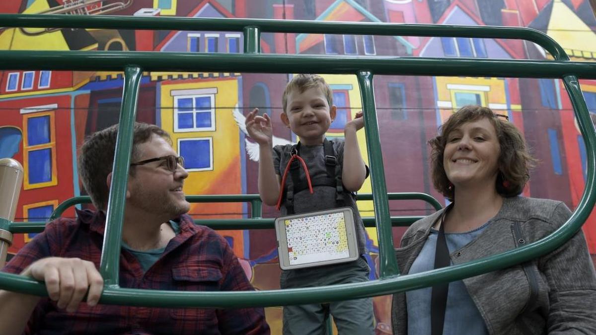 In this photo taken May 8, 2017, David Rosenblatt, left, 36, a freelance labor researcher, his wife Karen Hoerst, right, 35, a union organizer, and their son Nico, 5, play at Westminster Park in Washington. Nico Rosenblatt cannot speak and struggles to learn because of a rare genetic condition, yet thrives when surrounded by other children in a regular classroom, according to his parents. However, they say neither the public school system nor a charter school in the nation’s capital could provide an inclusive environment for him.