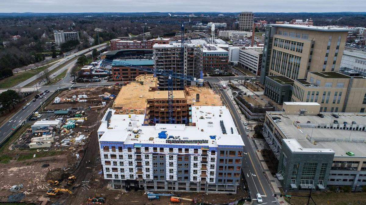 Hundreds of apartments, like the ones shown in this picture, are being built near Durham Bulls Athletic Park in downtown Durham. As the city grows, residents worry gentrification will come with it.