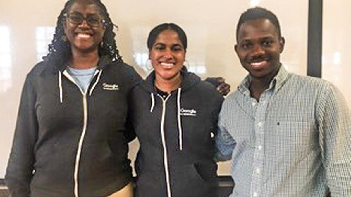 Charlene Brown, founder of Reciprocare, and Stephanie Cummings, founder of Please Assist Me, sport their Google for Entrepreneurs sweatshirts with Bernard Worthy, founder of Loanable.