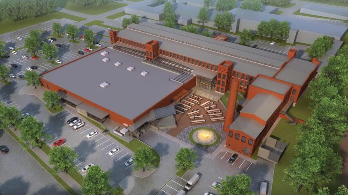A rendering of the Cordoba building on 800 Taylor Street, which LRC Properties intends to redevelop into an office building with an attached music venue as part of its ownership of the Golden Belt campus. The Cordoba building is pictured here with the rest of the Golden Belt campus to the north of the rendering.