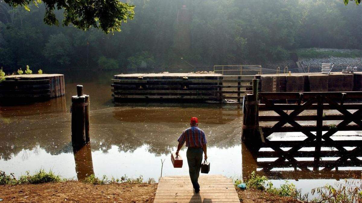 Billy Locklear, from Robeson County, brings his tackle box to the shores of the Cape Fear River at the William O. Huske Lock and Dam in 2004. A Chemours plant near Fayetteville has admitted to dumping GenX into the river that provides the drinking water for much of southeastern North Carolina.