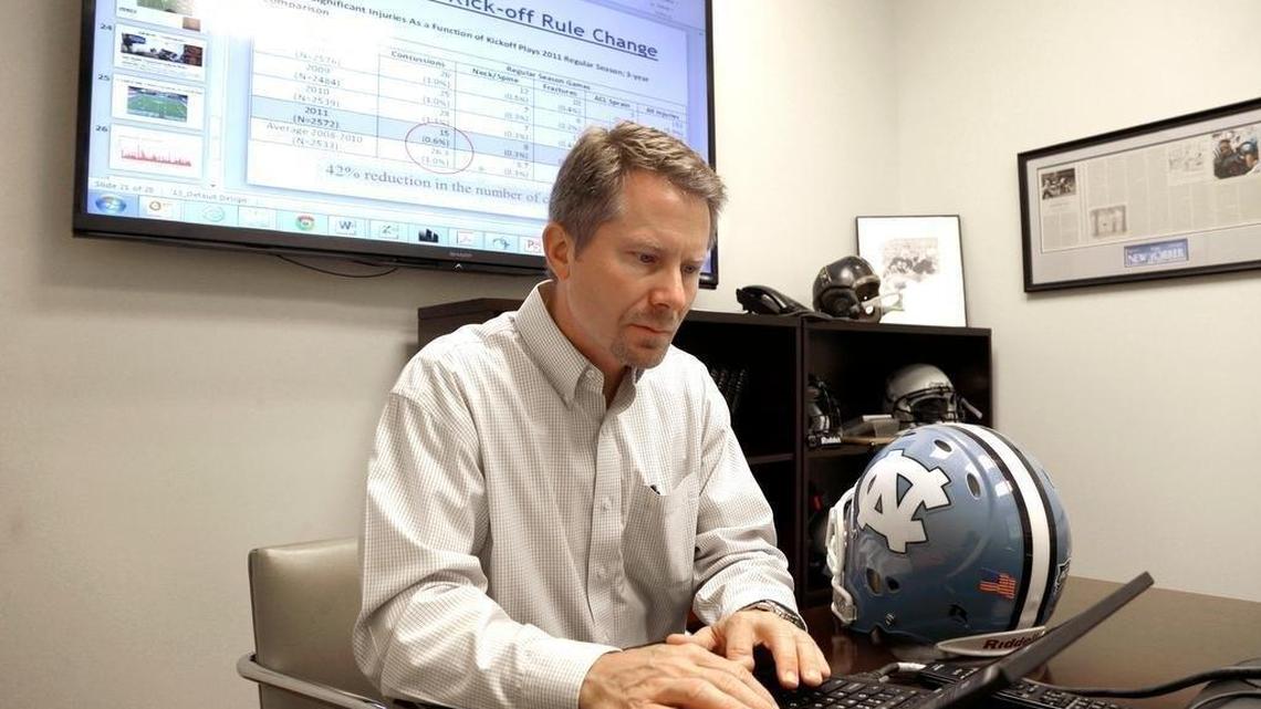 In this 2015 photo Kevin Guskiewicz, professor and former chair of the Department of Exercise and Sports Medicine at the College of Arts and Sciences, conducts research on helmet sensors at the University of North Carolina in Chapel Hill, N.C.