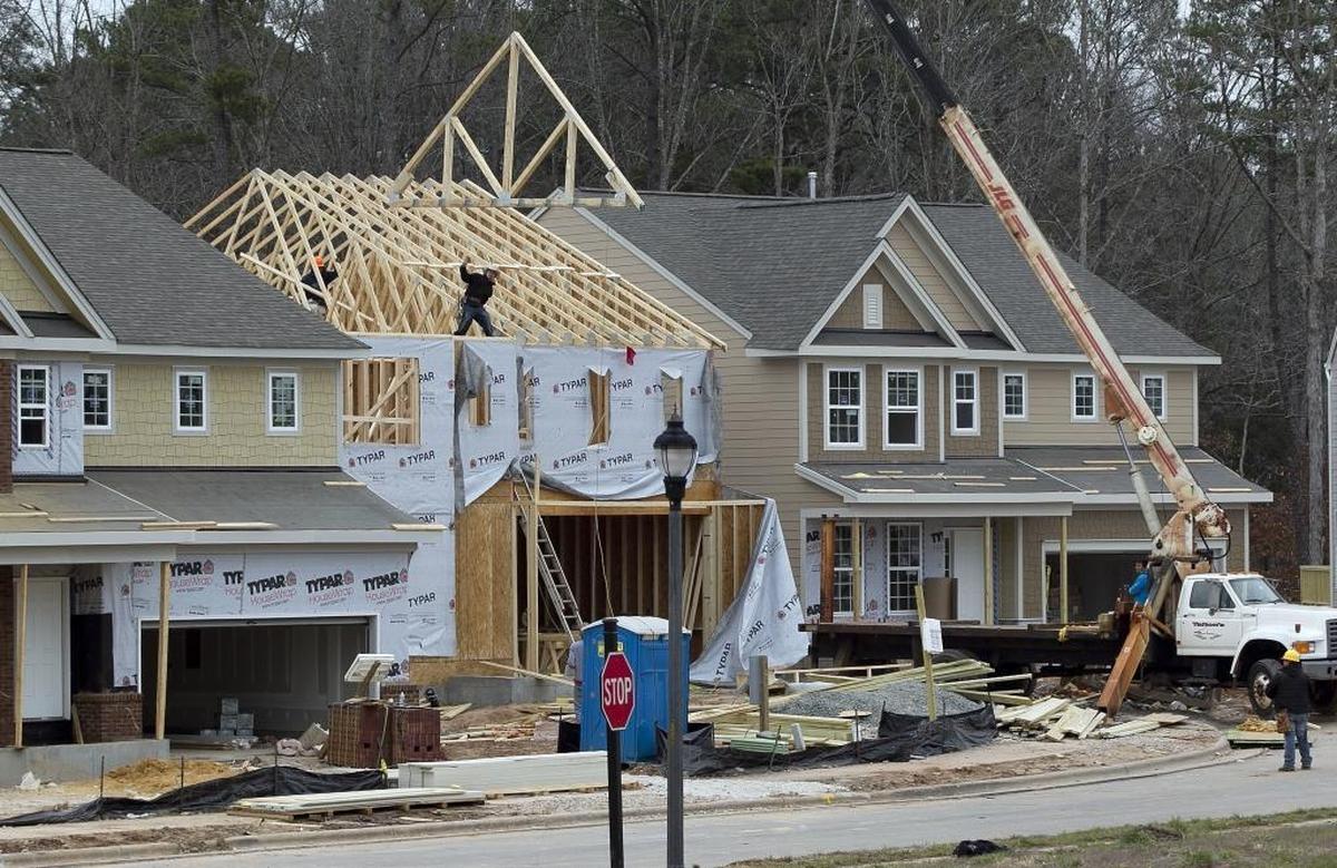 Construction is booming on Blue Jack Oak Drive in the Amberly subdivision on Thursday February 7, 2013 in Cary, N.C. After overcoming some financial trouble that slowed the construction of the 5,000 unit subdivision, homes are on the rise again on land that straddles the Wake and Chatham county lines off O'Kelley Chapel Road.
