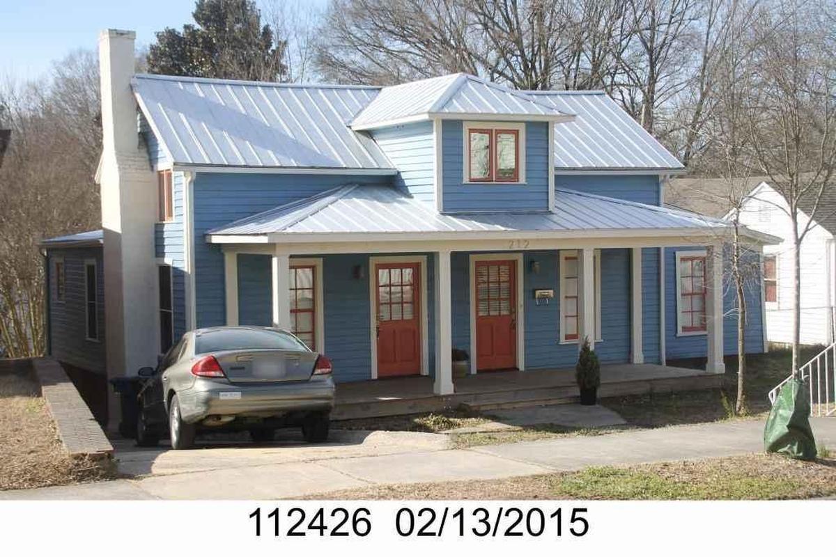 A picture of a home on 212 S. Driver St. in 2015. A few years earlier, the house had sat vacant and its windows were covered with plywood.