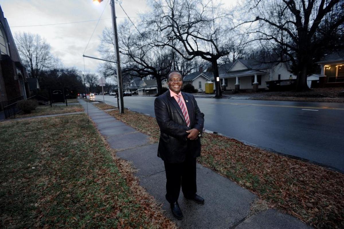 Pastor Johannes Nyanda Gumbo outside the Shepherd's House United Methodist Church on North Driver Street.
