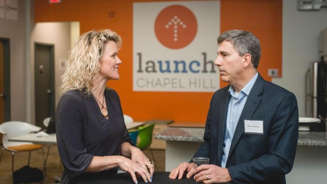 Tiffany Devereux of Jury-X, left, and Steve Beisser of Academic Benchmarking Consortium speak at Launch Chapel Hill’s fifth anniversary party. The two have moved their companies out of Launch and into offices in Chapel Hill.
