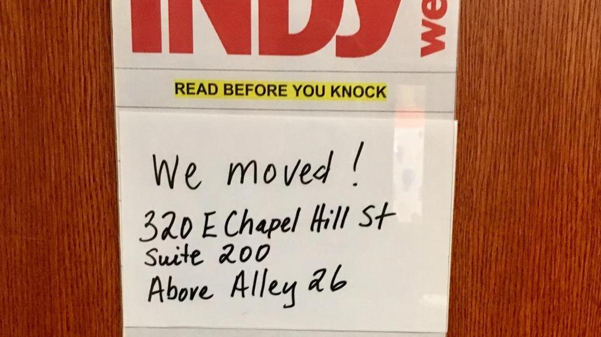 A sign posted on the door of Indy Week’s offices at 201 W. Main St.