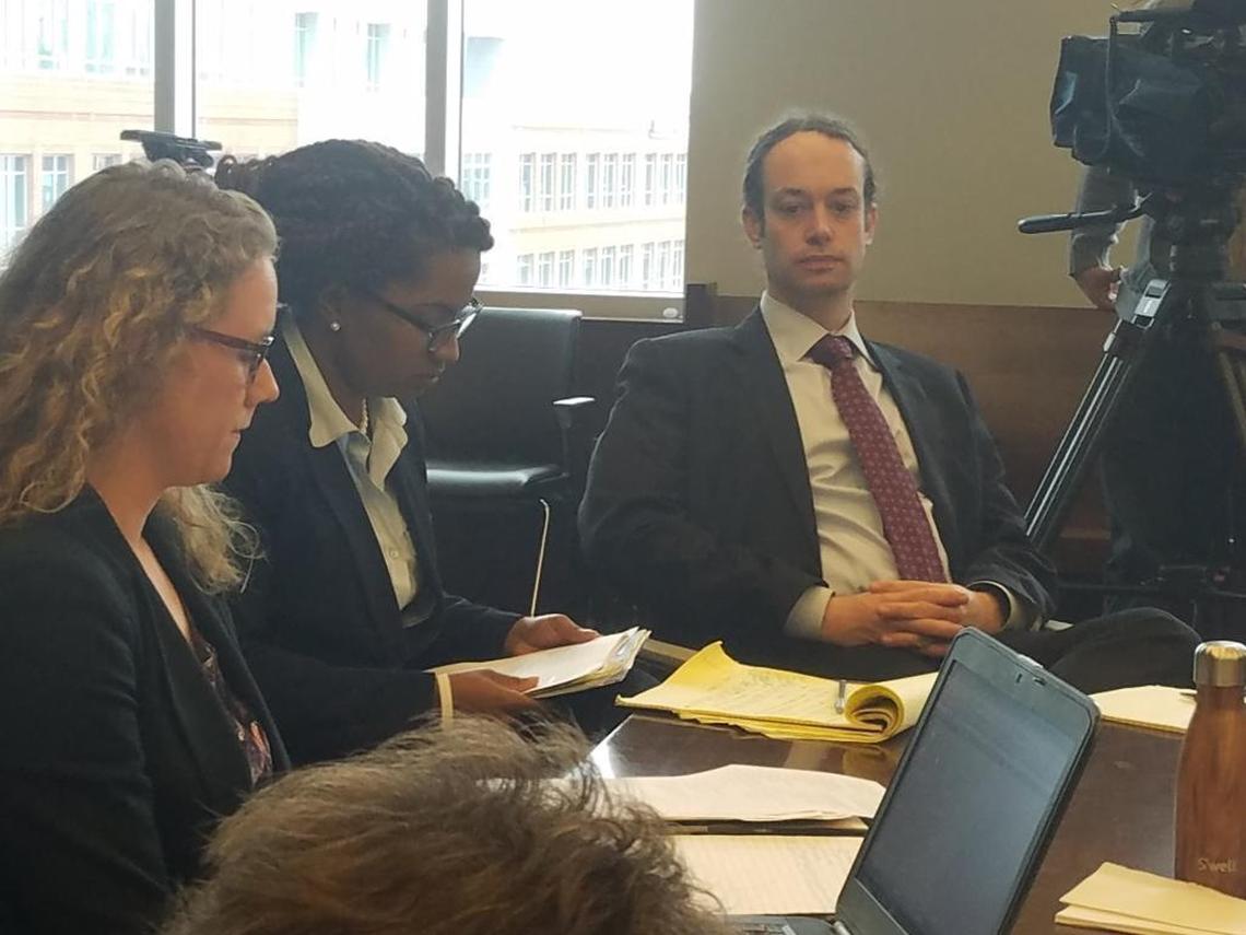 A judge dismissed charges against Peter Gilbert, in the red tie, in the Confederate statue toppling case.