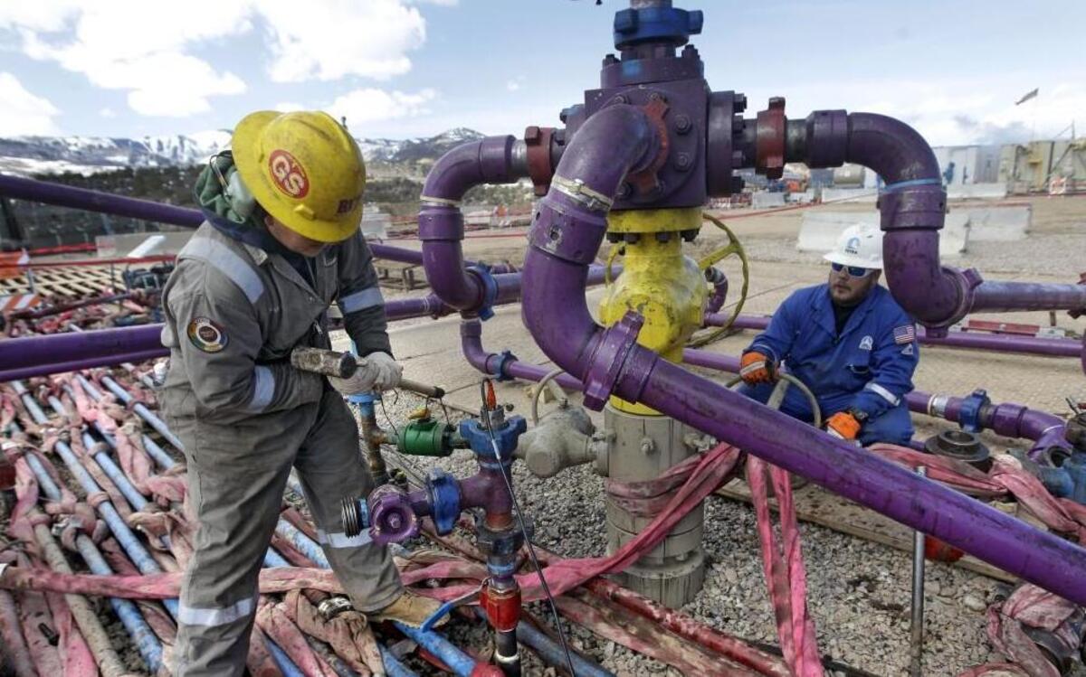 In this March 29, 2013 photo, workers tend to a well head during a hydraulic fracturing operation at an Encana Oil & Gas (USA) Inc. gas well outside Rifle, in western Colorado. The first experimental hydraulic fracturing occurred in 1947. More than 1 million U.S. oil and gas wells have been fracked since, according to the American Petroleum Institute.