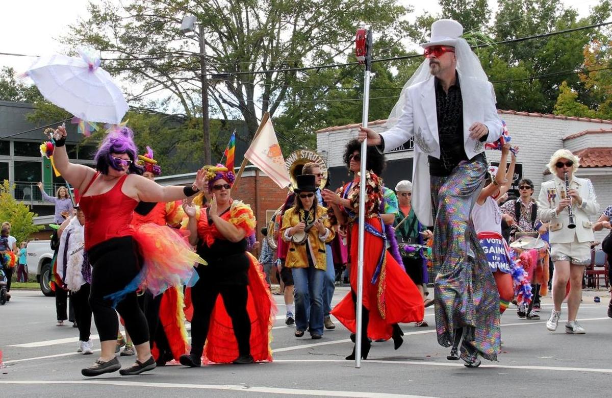 Durham hometown favorites The Bulltown Strutters, parade down Broad Street. Thousands filled the Duke East Campus neighborhood Saturday, Sept. 28, 2013, for the annual N.C. Gay Pride march and rally.