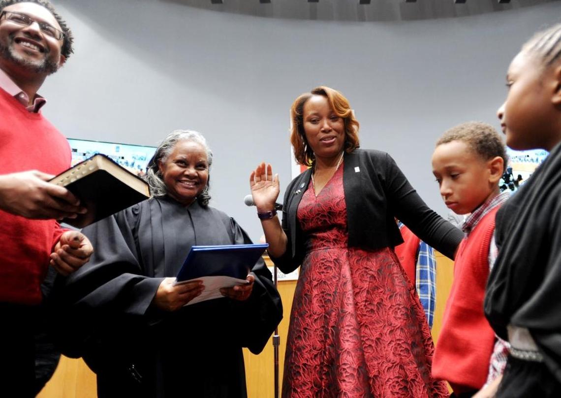 DeDreana Freeman (center) takes office as a council member at City Hall, Monday Dec. 4, 2017.