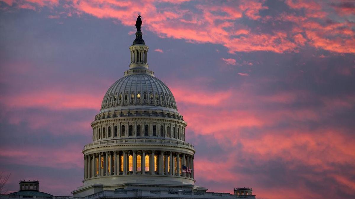 The sky over the U.S. Capitol was lit up at dawn late last week as Senate Republicans worked to pass their sweeping tax bill in Washington.