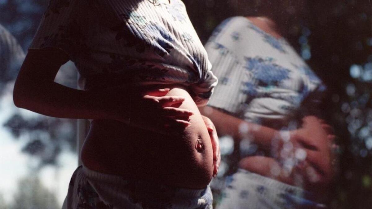This file photo from 2009 shows a pregnant teen who lives at a home for unwed mothers in Raleigh at the Christian Life Home. Teen pregnancies in North Carolina have declined 62 percent since 1996, according to state figures.