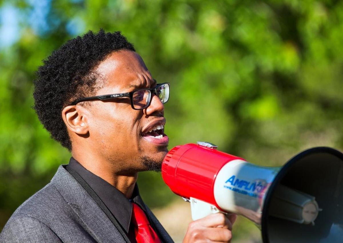 Dr. Kevin Bullock, the Durham Public Schools Director of Equity Affairs, speaks during a "walk-in" protest to support public education funding before class began at Southwest Elementary School on Monday May 8, 2017, in Durham, NC. The event kicked off a "Week of Action" organized by the North Carolina Association of Educators, including schools around the state and following with events at the general assembly and town halls.
