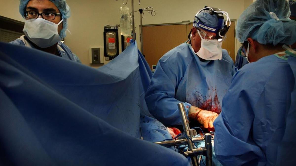 Surgeons at Harbor-UCLA Medical Center operate on a gunshot victim. A new study by a Duke professor rebuts the belief that more gunshot victims are surviving due to advances in medical care.
