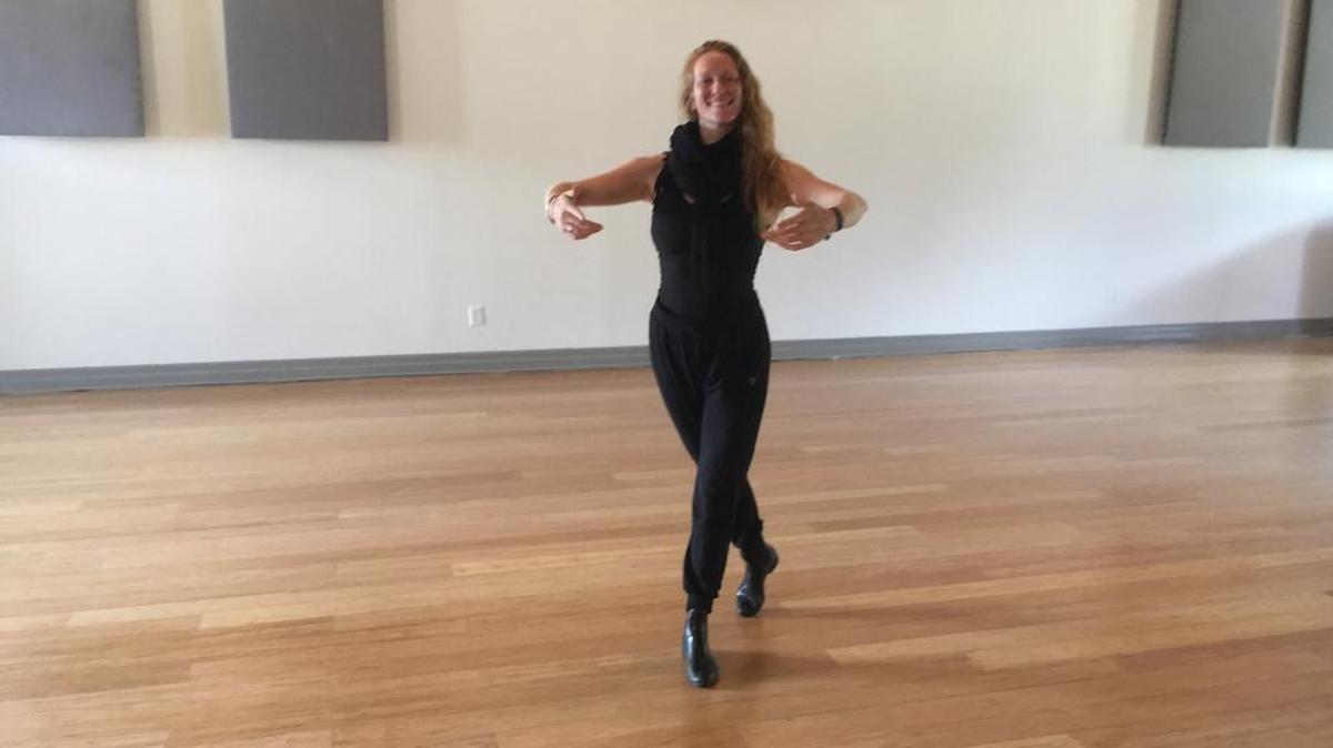 Aubrey Griffith-Zill, founder of Living Arts Collective, demonstrates the venue’s new ‘sprung floor’ used for dance and other movement arts.