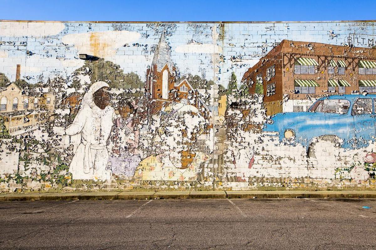 A weathered mural graces the Hayti neighborhood, once dubbed “Black Wall Street” by Booker T. Washington.