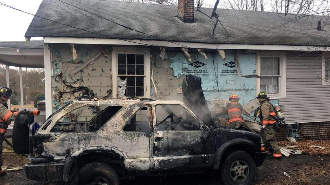 Durham Fire Department firefighters were cleaning up the scene of a vehicle fire that also damaged a house Monday, Jan. 8, 2018, on East Lawson Street.