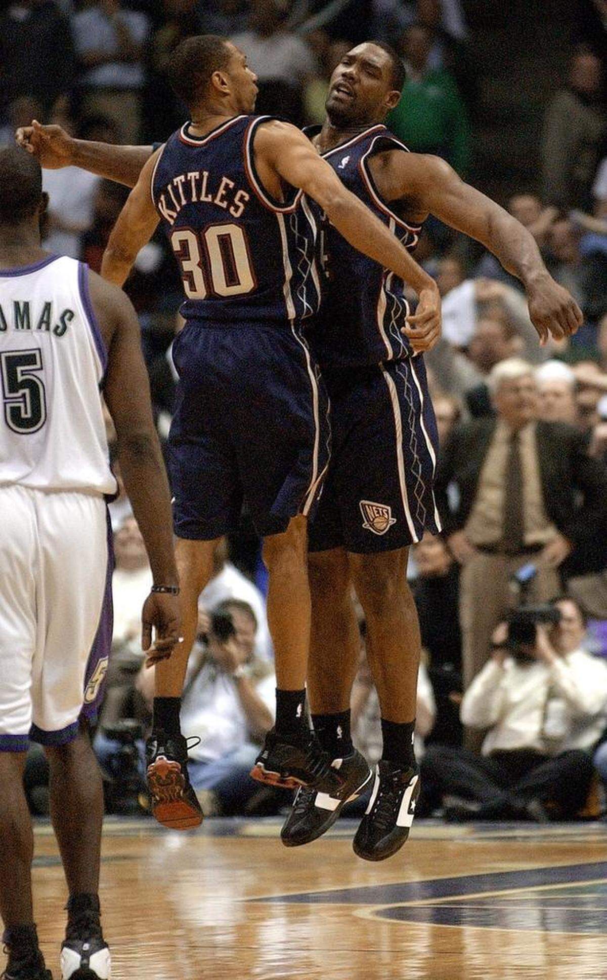New Jersey Nets' Rodney Rogers is congratulated by Kerry Kittles after making the game-winning shot in the final seconds of their first round NBA playoff game against the Milwaukee Bucks Thursday, April 24, 2003, in Milwaukee. The Nets won, 103-101. (AP Photo/Morry Gash)