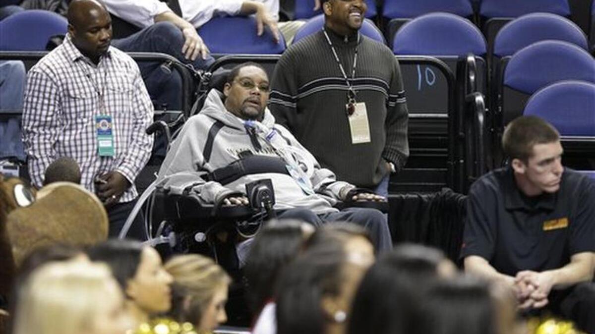 Rodney Rogers, center, watches during the first half of an NCAA college basketball game between Wake Forest and Maryland at the Atlantic Coast Conference men's basketball tournament in Greensboro on March 14, 2013.
